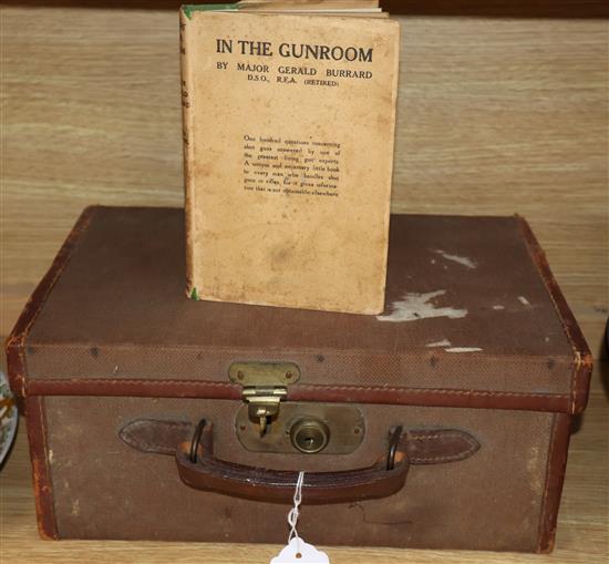 A Victorian cartridge case and an edition of In the Gunroom by Major Gerald Burrard